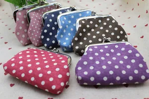 Detailed view of various colorful polka dot coin purses with vintage metal kiss-lock clasps