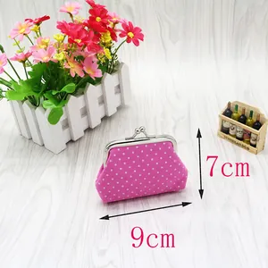 Pink polka dot fabric coin purse with metal clasp closure, size detail 9cm by 7cm