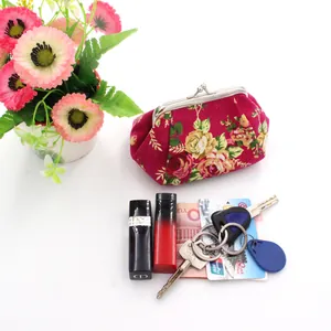 Detail of vintage canvas coin purse showing interior storage for cards and lipstick