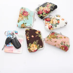 Set of five floral canvas kiss-lock coin purses in vintage rose patterns and diverse colors