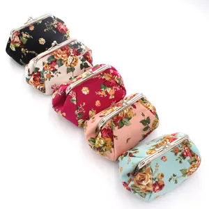 Five assorted vintage floral canvas coin purses with silver metal kiss-lock clasps