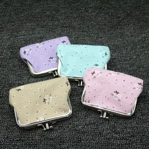 Floral print kiss-lock coin purses in cotton fabric with four pastel color options