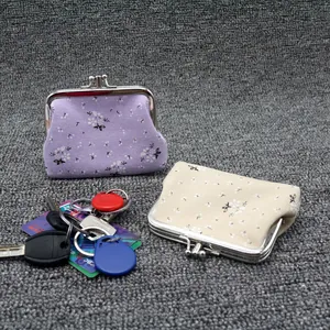 Floral print canvas coin purse with metal clasp closure in purple and beige