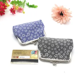 Floral fabric coin purse with metal clasp closure in purple and dark grey colors