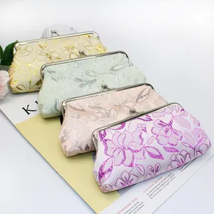 Set of four floral brocade long wallets with vintage metal clasp and silk sheen finish