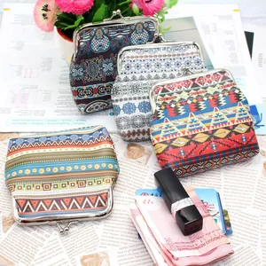 Detail of bohemian coin purses with vintage metal clasps and diverse ethnic stripe patterns