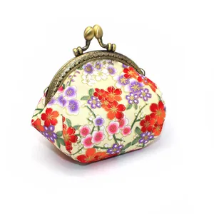 Detail of vintage Japanese cherry blossom pattern on fabric with bronze metal clasp