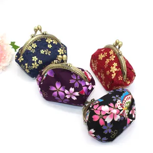 Japanese style fabric coin purses with gold floral patterns and vintage metal clasps