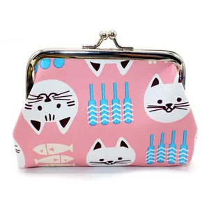 Detail of pink cartoon cat coin purse featuring retro metal clasp and textured faux leather