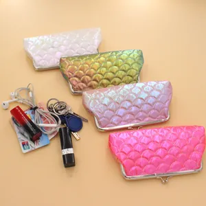 Detailed view of colorful laser mermaid scale coin purses with metallic kiss lock closure
