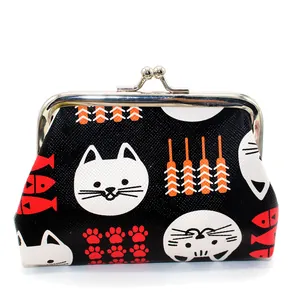 Close-up of retro black cat coin purse with Japanese patterns and silver metal clasp