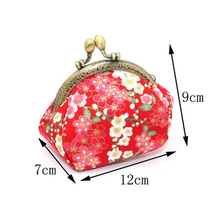Handmade Japanese style fabric coin purse with red cherry blossom pattern and metal clasp