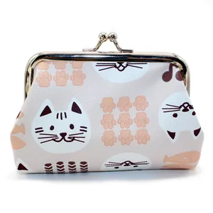 Close-up of cute cartoon cat pattern on PU leather coin purse with metal ball clasp