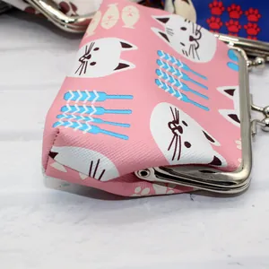 Detail of pink cartoon cat coin purse with silver metal clasp and faux leather texture