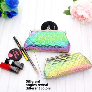 Macro shot of shell-shaped laser scales makeup bag with iridescent gradient effect