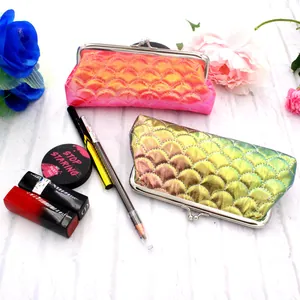 Detailed view of colorful laser fish scale makeup bags with vintage metal frames