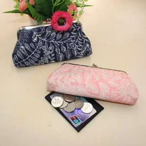 Floral canvas coin purses with metal leaf clasp and elegant botanical leaf print patterns