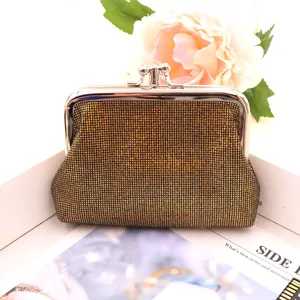 Detail view of vintage double-layer PU purse with shimmering gold mesh and kiss-lock closure