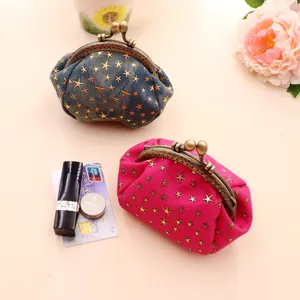 Mini denim coin purses with star pattern shown next to card and lipstick for scale