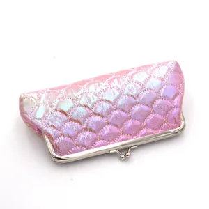 Detailed view of pink mermaid scale texture on a laser iridescent long clutch wallet