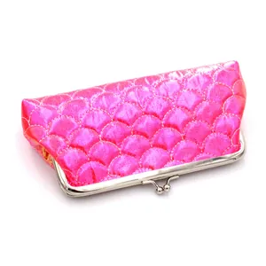 Detailed view of pink laser fish scale texture with vintage silver metal clasp closure