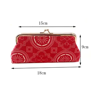 Red geometric canvas kiss-lock clutch purse for women with dimensions 18x15x9cm