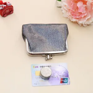 Close-up of vintage silver sequin coin purse with durable metal frame kiss-lock closure