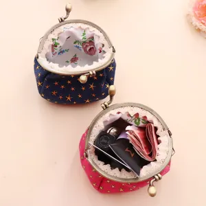 Retro denim coin purse with gold star patterns and vintage lace trim details