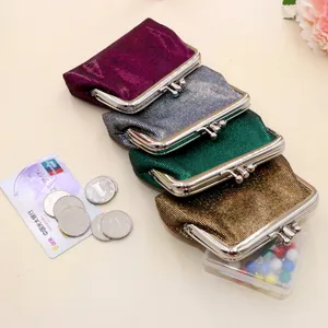 Detailed view of four vintage sequin coin purses in purple, silver, green, and gold colors