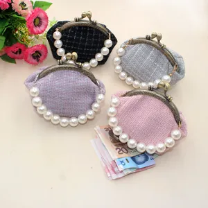 Collectie tweed portemonnees met parelhandvatten in vier verschillende zachte kleuren