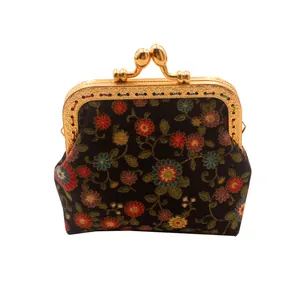 Handmade vintage floral coin purse with gold kiss-clasp closure and colorful patterns