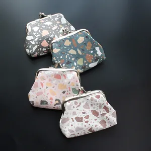 Detail of colorful terrazzo pattern PU leather coin purses with silver kiss-lock closures