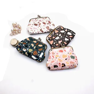 Detail of mini coin purses with stone patterns and vintage metal clasps in four colors