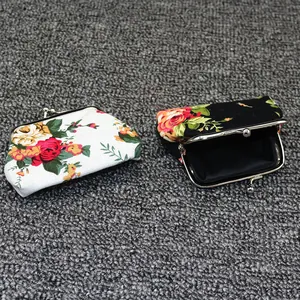Detail showing retro floral canvas coin purses with vintage metal kiss lock closure