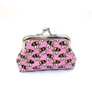 Detail of pink PU laser bee coin purse with a vintage silver metal kiss lock closure