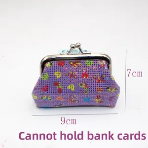 Detail of purple sequin mini coin purse with metal clasp and heart patterns 9x7cm