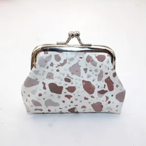 Close-up of stone pattern mini coin purse with silver metal kiss-lock clasp closure