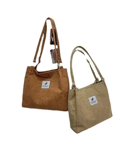 Large capacity corduroy tote bag in brown and beige with minimalist feather label