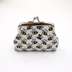 Detail of laser printed honey bee patterns on small PU leather coin purse with metal clasp