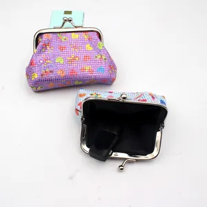 Detail view of mini PU laser coin purses with vintage metal clasp and cute patterns