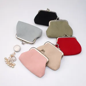 Detail shot of vintage canvas coin purses with retro metal clasp in six assorted colors
