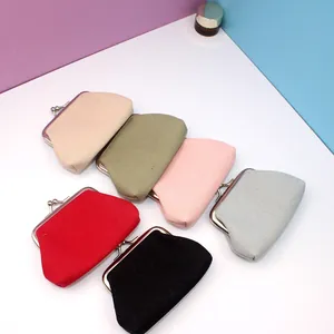 Detailed view of canvas coin purses in six colors with vintage metal clasp closure