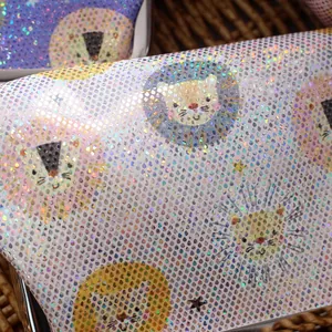 Detailed macro view of laser PU coin purse with sparkling holographic lion head pattern