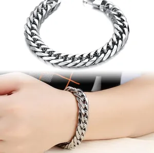 Macro shot of silver punk curb chain bracelet with durable rectangular clasp and mirror finish