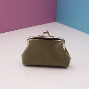 Army green canvas coin purse with silver metal clasp closure on a colorful backdrop