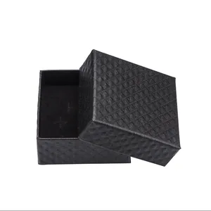Close-up of black jewelry gift box featuring diamond pattern texture and flocking liner