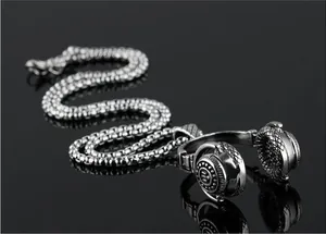 Detail of headphones pendant with diamond grid texture on box chain necklace
