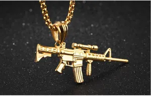 Macro shot of detailed golden stainless steel rifle pendant on a square box chain