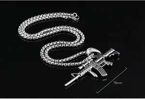 Macro shot of 76mm stainless steel rifle pendant necklace with detailed box chain