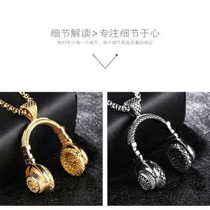 Detail of gold and silver headphone pendants with diamond texture and box chains